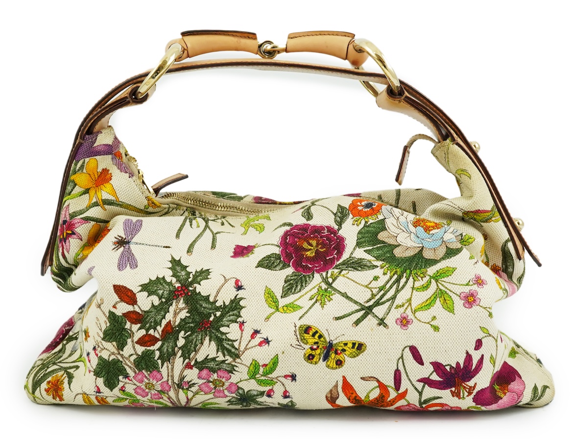 A Gucci flora canvas horse-bit hobo bag with dust bag